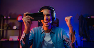 gamer playing video games online on a mobile handheld device