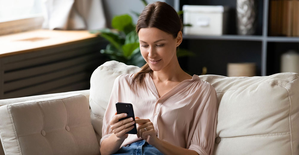 smartphone user checking branded caller ID